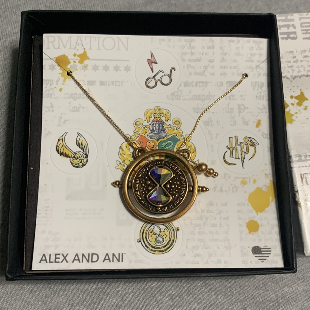 NEVER BEEN WORN NEW Adjustable Alex and Annie Harry Potter spinning necklace.